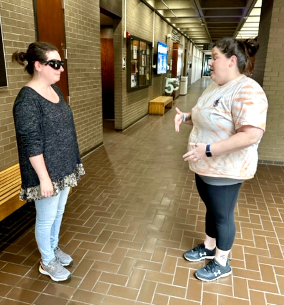 Students discussing human guide with LVSK goggles